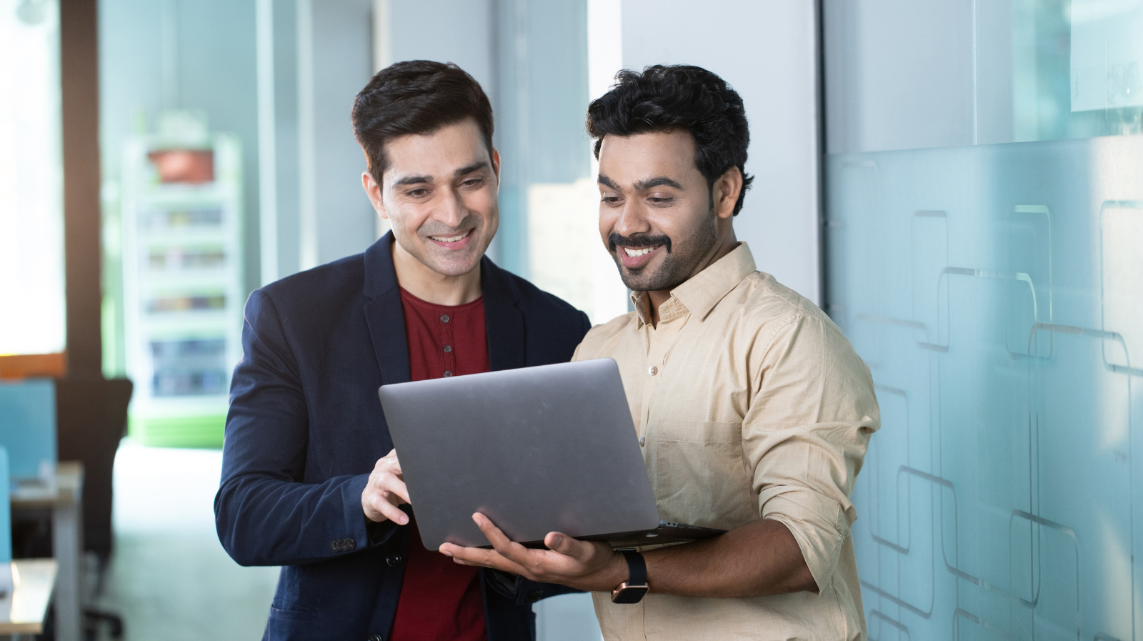Two team members at Xperno Digital collaborating on a laptop, representing the agency’s human-centered approach to digital marketing.